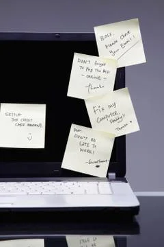 Adhesive notes on laptop screen Stock Photos