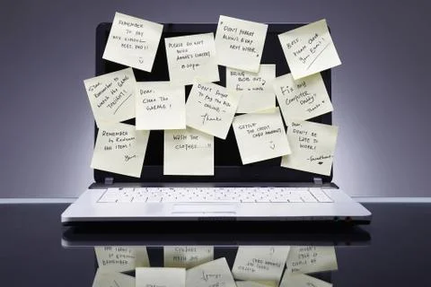 Adhesive notes on laptop screen Stock Photos