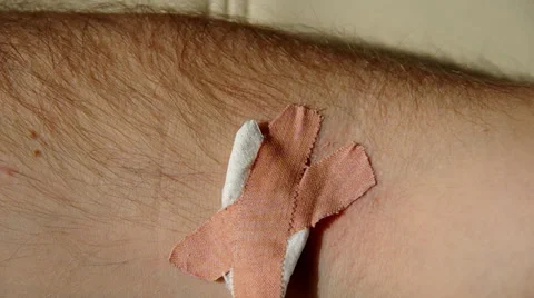 Adhesive plaster on hand Stock Footage 36647830