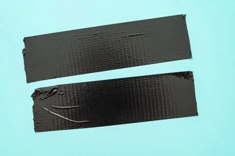 Adhesive tapes on a light blue background – texture with creases and contrasts Stock Photos