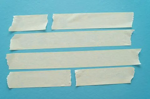 Adhesive tapes on a light blue background – texture with creases and contrasts Stock Photos