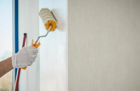 Adhesive Wallpaper Glue Applying Using Roller Stock Photos
