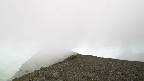 Adiabatic clouds form and rise over a mountain ridge on Ben More, Mull, Scotland Stock Footage 138402698