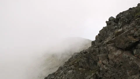 Adiabatic clouds form and rise over a mountainside on Ben More, Mull, Scotland Stock Footage 138416357