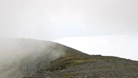 Adiabatic clouds form and rise over a mountain ridge on Ben More, Mull, Scotland Stock Footage 138416529