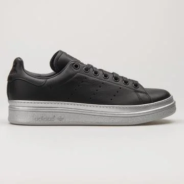 Adidas Stan Smith Bold black and silver sneaker Stock Photos