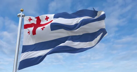 Adjara flag with flagpole waving in rolling clouds looping, 4K (Perfect Loop) Video stock 288684983