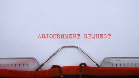 Adjournment request - phrase printed on an old typewriter in red letters Stock Footage 128400186