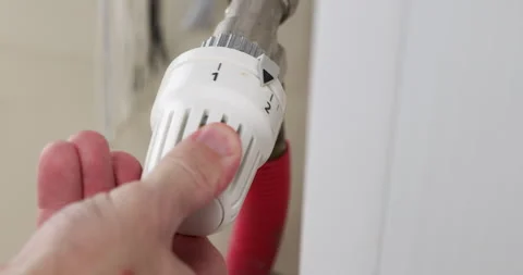 Adjust Temperature Hand Temperature Controller on Heating Radiator.  Stock Footage 250481085