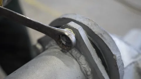 Adjustable bolt. Loosening the nut using a wrench Stock Footage 300760251