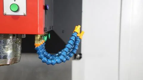 Adjustable coolant hoses on an industrial machine tool spindle assembly. Stock Photos
