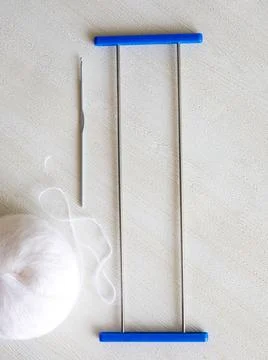 Adjustable crochet fork for making lace, crocheting hook and woolen yarn ball Stock Photos