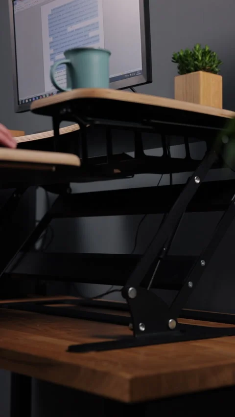 Adjustable height table, computer table, Adjustable Desk Stock Footage 297185832