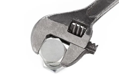 Adjustable spanner and nut Adjustable spanner and nut isolated on white ba... Stock Photos