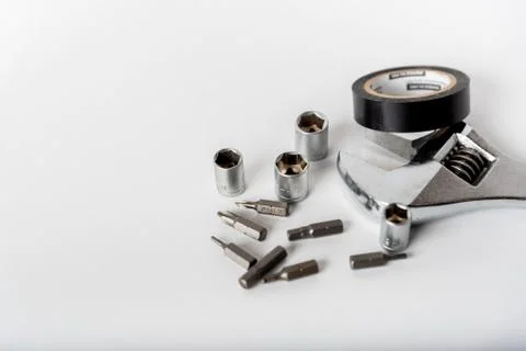 Adjustable spanner and other tools on a white background Foto stock