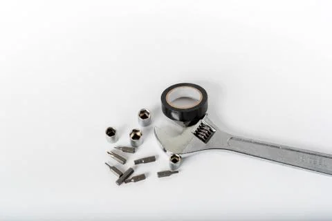 Adjustable spanner and other tools on a white background Stock Photos