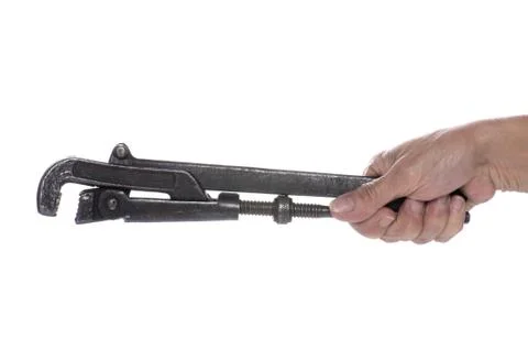 Adjustable spanner in hand macro Stock Photos