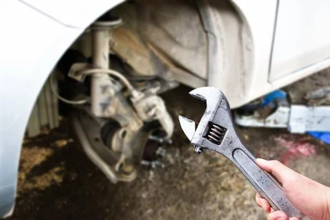 An adjustable spanner or adjustable wrench in the hand Stock Photos