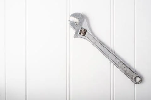 Adjustable spanner tool on white background Stock Photos