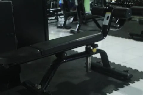 Adjustable Weight Bench in Empty Gym Interior Stock Photos