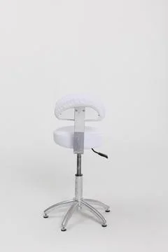 An Adjustable White Stool featuring a Chrome Base, perfect for enhancing Modern 写真素材