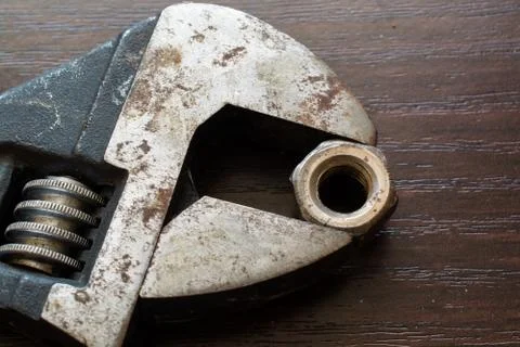 Adjustable Wrench and Nut. Stock Photos