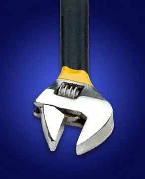 Adjustable Wrench on Blue Background Stock Photos