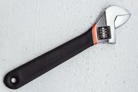 Adjustable wrench tool top view on a white background. Stock Photos