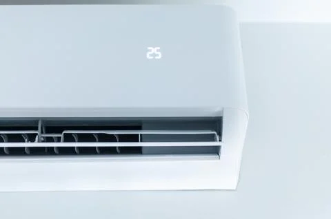 Adjusting air conditioning settings for optimal comfort in home spaces mode.. Stock Photos