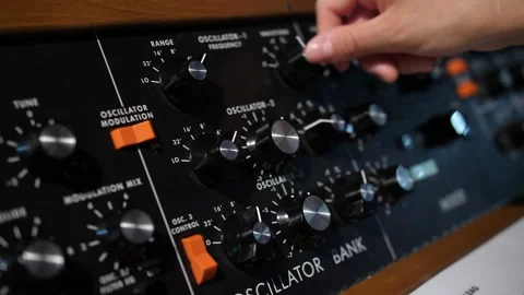 Adjusting amplitude frequency dials on a oscillator analogue bank Stock Footage 221959420