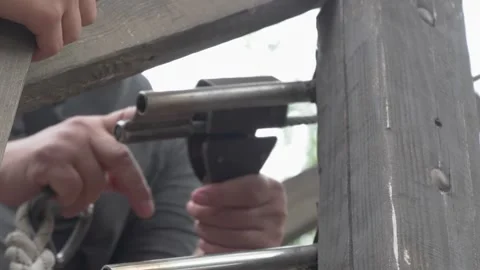 Adjusting and maintaining Equipment within a Beautiful Rustic Setting is Video stock 280997757