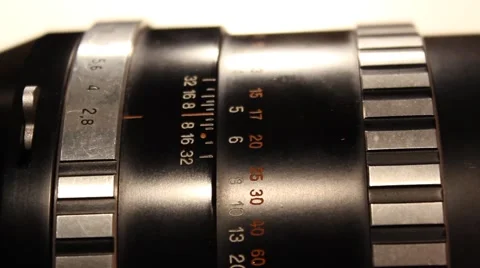 Adjusting aperture and focus on old camera lens Stock Footage 49240340