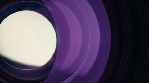 Adjusting aperture on camera lens. Close up view. Iris blades open close slowly Stock Footage 252817292