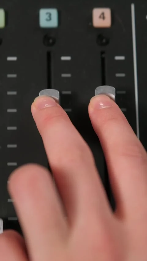 Adjusting audio faders on mixing console Stock Footage 306779782