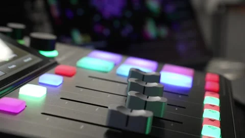 Adjusting Audio Volume on Mixer Panel with Lightened Button Controls Stock Footage 310139232