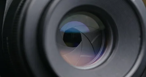 Adjusting Camera lens aperture Stock Footage 95878601