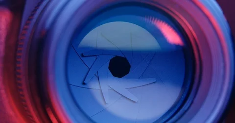 Adjusting Camera lens aperture with pink and purple Stock Footage 95928227