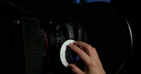 Adjusting Camera Lens in a studio Stock Footage 243337072
