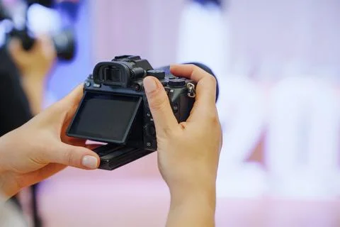 Adjusting Camera Screen Settings During School Assembly Stock Photos