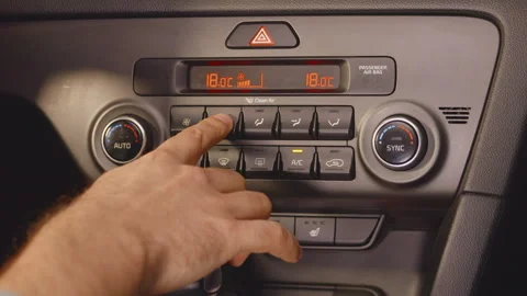 Adjusting car air conditioning, close up of vehicle climate control panel Stock Footage 257101102