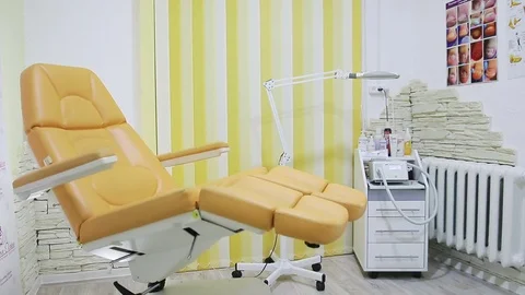 Adjusting the chair for a pedicure 스톡 동영상 83457864