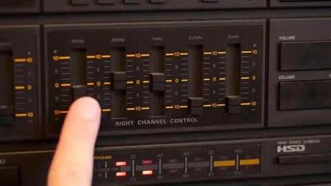 Adjusting channel equalizer on vintage audio system Stock Footage 88256592