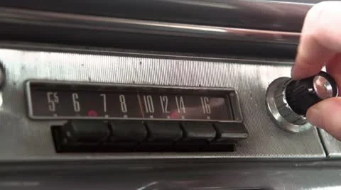 Adjusting classic car stereo Vídeos de archivo 12409734