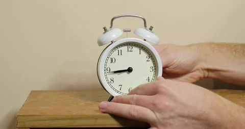 Adjusting clock back one hour, dst end, Stock Footage 229358457