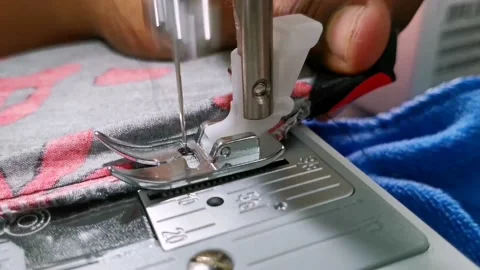 Adjusting clothes during stitching Stock Footage 137489157