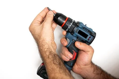 Adjusting drill chuck to insert drill bit Stock Photos