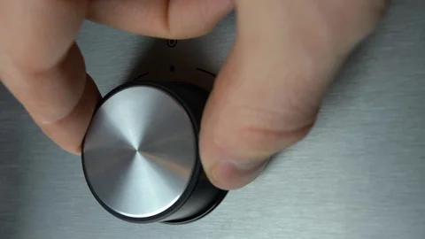 Adjusting Electric Oven Temperature by Turning the Oven Switch Close Up Stock Footage 125897882