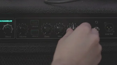 Adjusting EQ knobs on a bass amp Stock Footage 89800089