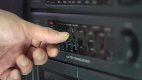 Adjusting the equalizer switches on the tape recorder 4K Stock Footage 168892877
