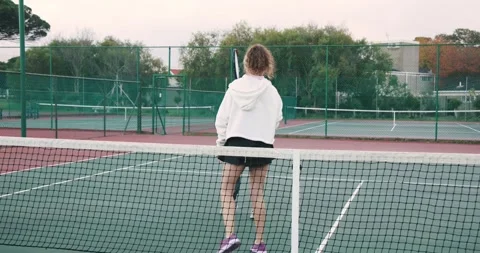 Adjusting grip, diverse coach and students practicing volley control on court Stock Footage 336658079